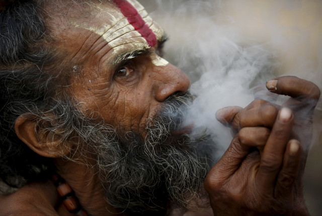 tobacco in hinduism Sadhu Hindu Holy Man Smokes Marijuana Editorial Stock Photo - Stock Image Licensable picture: Hindu holy man,