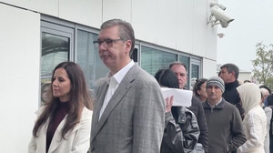 REFILE: Serbia's ex-president Vucic in hours-long queue to vote in historic election