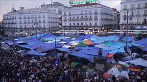 Night falls on Madrid's Puerta del Sol as housing protests reach fourth day