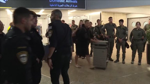 REFILE: Passengers affected by in-flight pilot stabbing incident arrive at Israel's airport