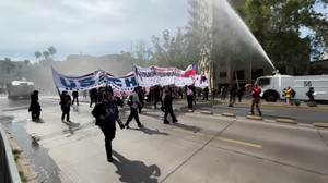 Police use water cannon to disperse Chilean student protest against education cuts