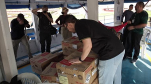 Electoral workers navigate Amazon waters with voting machines for remote communities