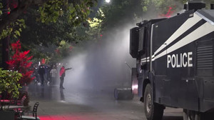 Kosovo police use water cannons as protesters demonstrate over war crimes court law