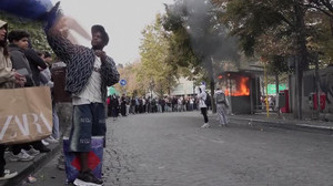 Belgium students set fires as police deploy water cannon