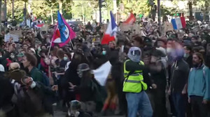 Police and protesters clash on Paris square, water cannons and tear gas fired