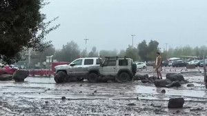 Santiago residents describe sudden flooding as overflowing river sweeps through streets