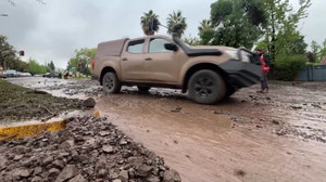 Santiago residents assess damage as soldiers help remove mud and debris after floods