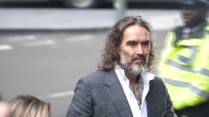 Russell Brand arrives at London court ahead of trial start