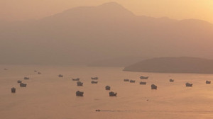 Vessels near Hormuz at sunrise, as Iran says US response to proposal to reopen strait falls short