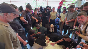 Palestinians hold funeral for people killed in Israeli strikes