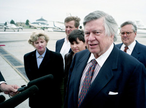 Houston Oilers owner Bud Adams, front, with his family, speaks to the media after arriving at Nashville International Airport on