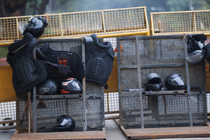 Safety equipments belonging to security personnel rests on a police barricade on the day of a Cockroach Janta Party (CJP) protest seeking the resignation of India's Chief Election Commissioner, Gyanesh Kumar, in New Delhi