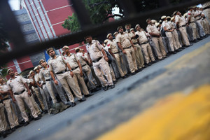 Security personnel stand guard outside the headquarters of the Election Commission of India on the day of a CJP protest seeking the resignation of India's Chief Election Commissioner, Gyanesh Kumar, in New Delhi