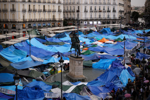 Protesters camp in Puerta del Sol square demanding political action to stop evictions and address the housing crisis, in Madrid