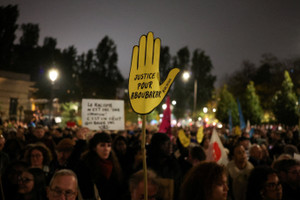 People take part in a gathering in Paris, following the October 23 shooting in Trappes in which 26-year-old Pengo Bossio Wangi was killed