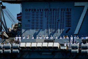 The US Navy Nimitz-class aircraft carrier USS Abraham Lincoln returns home following an extended deployment in the Middle East at Naval Base Coronado in San Diego