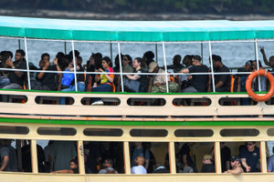 USS George H.W. Bush arrives for retreat after supporting operations in Middle East, in Phuket