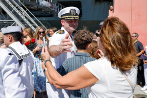 The US Navy Nimitz-class aircraft carrier USS Abraham Lincoln returns home following an extended deployment in the Middle East at Naval Base Coronado in San Diego