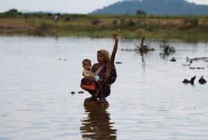 On mock funeral pyres and in rising waters, villagers resist India's river-linking project