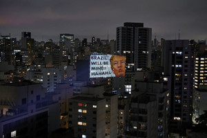 A person projects on a building as a protest ahead of the general election, in Sao Paulo