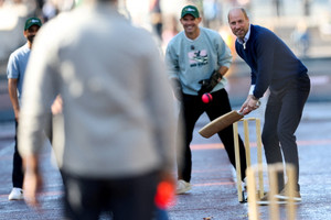 Britain's Prince William joins cricket stars for an informal game of cricket on The Mall, in London
