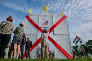 Demonstrators protest President Trump’s proposed triumphal arch at its planned site in Washington, D.C.