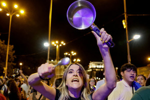 Demonstrators stage a pot-banging protest in Madrid