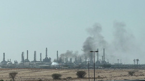 Smoke rises from a fire at the Aramco refinery south of Riyadh