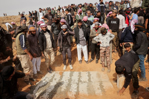 Mourners attend the funeral killed in a reported Jordanian airstrike in the town of Al-Mismiyah