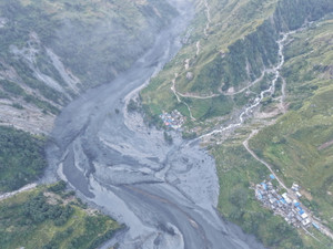 A drone view shows the areas affected by flooding of Budhi Gandaki River following a dry landslide in Chumnubri village, Gorkha district