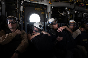 The Wider Image: On the USS George Washington, young sailors adjust to war with Iran