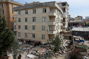 Rescuers search debris after partial building collapse in Istanbul
